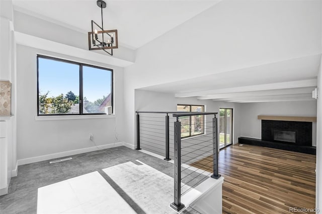 7351 S Marion St, Centennial, CO 80122 - unfurnished living room with a chandelier and a fireplace