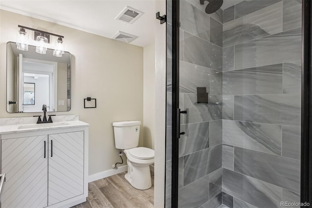 7351 S Marion St, Centennial, CO 80122 - full bathroom with a stall shower, vanity, and wood finished floors