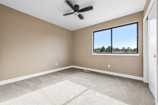 7351 S Marion St, Centennial, CO 80122 - carpeted spare room featuring baseboards and a ceiling fan