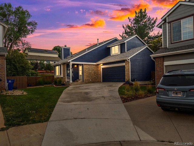 966 Cherry Blossom Ct, Highlands Ranch, CO 80126 - view of front of home featuring brick siding, driveway, and an attached garage