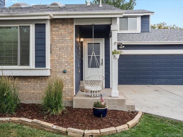 966 Cherry Blossom Ct, Highlands Ranch, CO 80126 - view of exterior entry with brick siding, driveway, a shingled roof, and a garage