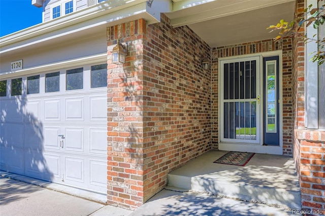 1730 Pear Ct, Brighton, CO 80601 - property entrance with brick siding and a garage