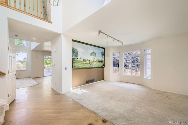 1730 Pear Ct, Brighton, CO 80601 - unfurnished living room featuring track lighting and light wood-style floors