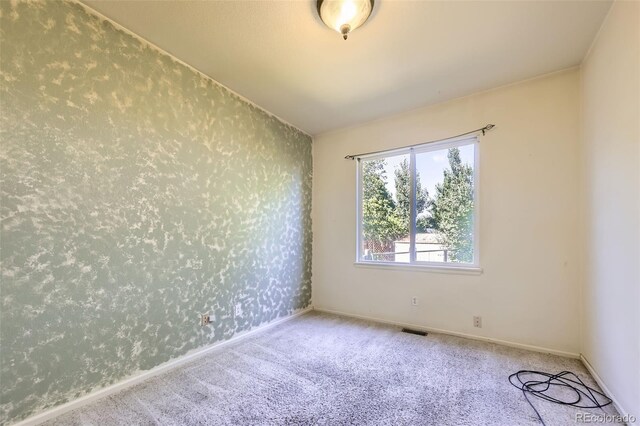 1730 Pear Ct, Brighton, CO 80601 - carpeted empty room with wallpapered walls and baseboards