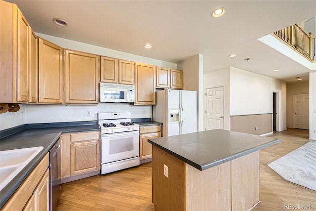 1730 Pear Ct, Brighton, CO 80601 - kitchen featuring white appliances, light brown cabinets, dark countertops, light wood finished floors, and recessed lighting