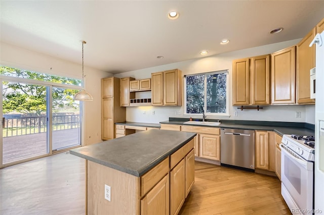 1730 Pear Ct, Brighton, CO 80601 - kitchen with white appliances, dark countertops, light brown cabinetry, light wood-style floors, and recessed lighting