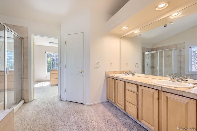 1730 Pear Ct, Brighton, CO 80601 - full bathroom featuring double vanity, a stall shower, vaulted ceiling, recessed lighting, and carpet