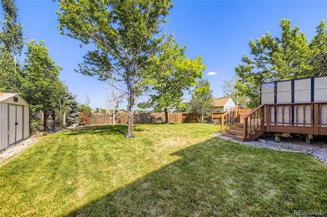 1730 Pear Ct, Brighton, CO 80601 - fenced backyard featuring a shed and a wooden deck