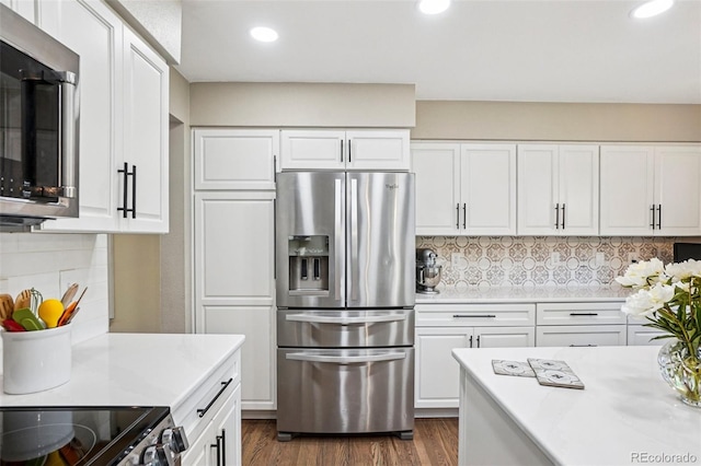 775 Poppywood Dr, Highlands Ranch, CO 80126 - kitchen featuring appliances with stainless steel finishes, light countertops, recessed lighting, and white cabinets