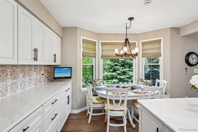 775 Poppywood Dr, Highlands Ranch, CO 80126 - dining room featuring plenty of natural light, a chandelier, and dark wood-style floors