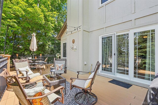 775 Poppywood Dr, Highlands Ranch, CO 80126 - wooden terrace with outdoor dining space