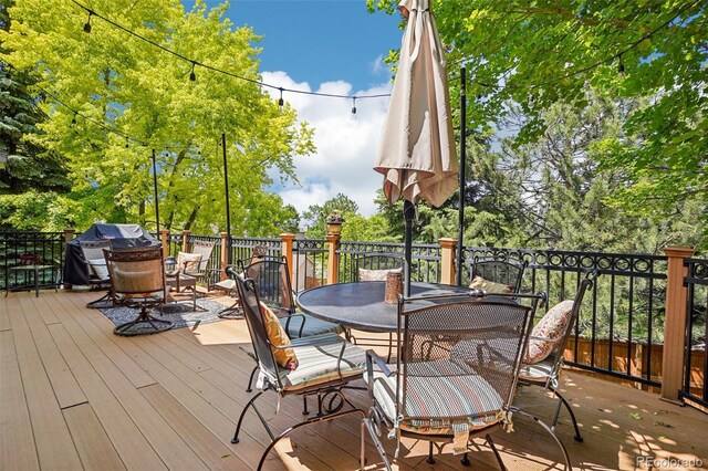 775 Poppywood Dr, Highlands Ranch, CO 80126 - wooden terrace with outdoor dining area and area for grilling