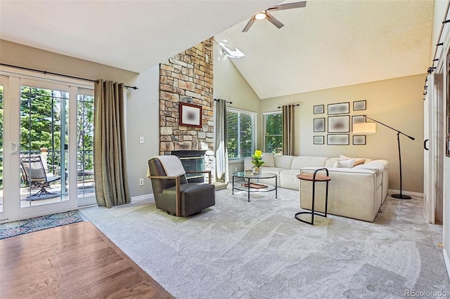 775 Poppywood Dr, Highlands Ranch, CO 80126 - living area with a ceiling fan, high vaulted ceiling, wood finished floors, and a fireplace