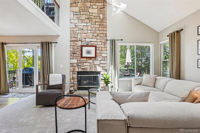 775 Poppywood Dr, Highlands Ranch, CO 80126 - living room featuring high vaulted ceiling, a fireplace, and wood finished floors