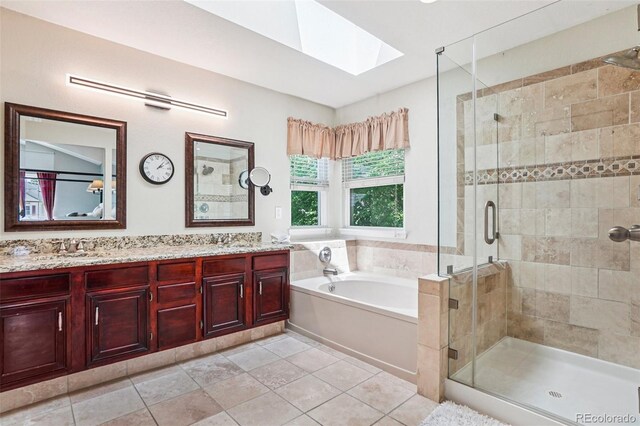775 Poppywood Dr, Highlands Ranch, CO 80126 - full bathroom with a skylight, a bath, a stall shower, double vanity, and tile patterned floors