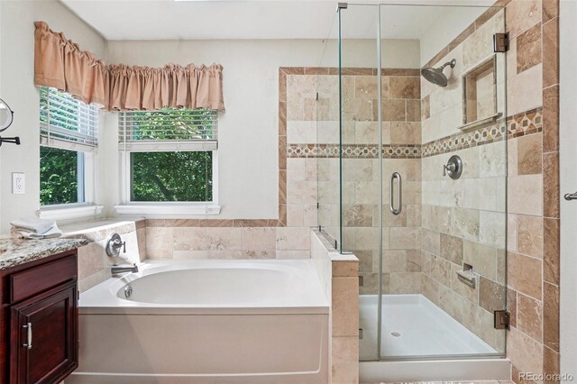 775 Poppywood Dr, Highlands Ranch, CO 80126 - bathroom featuring a garden tub, a stall shower, and vanity