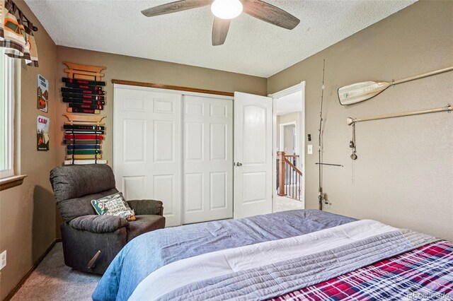 775 Poppywood Dr, Highlands Ranch, CO 80126 - carpeted bedroom with a textured ceiling, a ceiling fan, and a closet