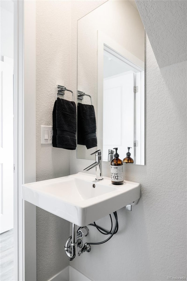 bathroom with a textured wall