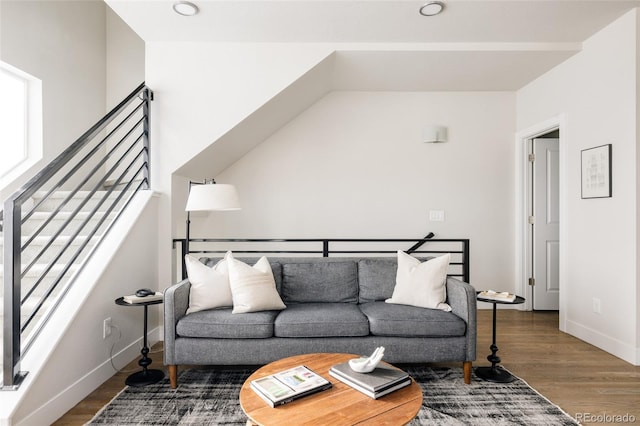 living room featuring baseboards and wood finished floors