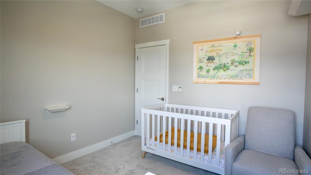 10018 E 62nd Ave, Denver, CO 80238 - carpeted bedroom with baseboards and a crib