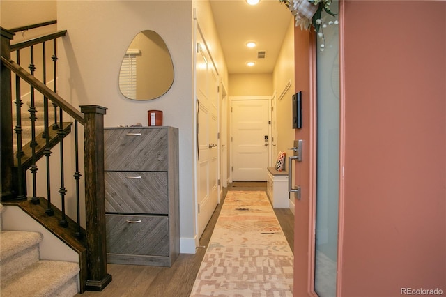10018 E 62nd Ave, Denver, CO 80238 - corridor featuring wood finished floors, stairway, and recessed lighting