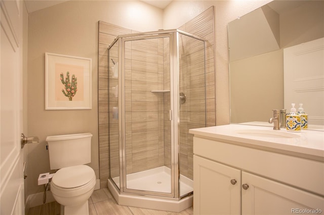 10018 E 62nd Ave, Denver, CO 80238 - full bathroom featuring vanity, toilet, a shower stall, and tile patterned floors