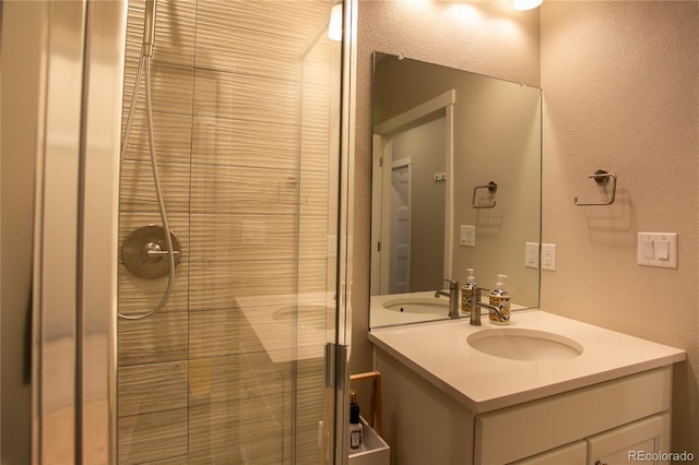 10018 E 62nd Ave, Denver, CO 80238 - full bathroom featuring vanity, a stall shower, and a textured wall