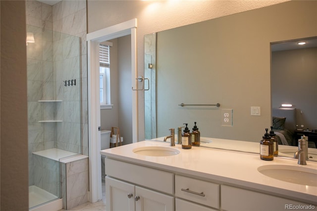 10018 E 62nd Ave, Denver, CO 80238 - bathroom featuring double vanity, toilet, and a shower stall