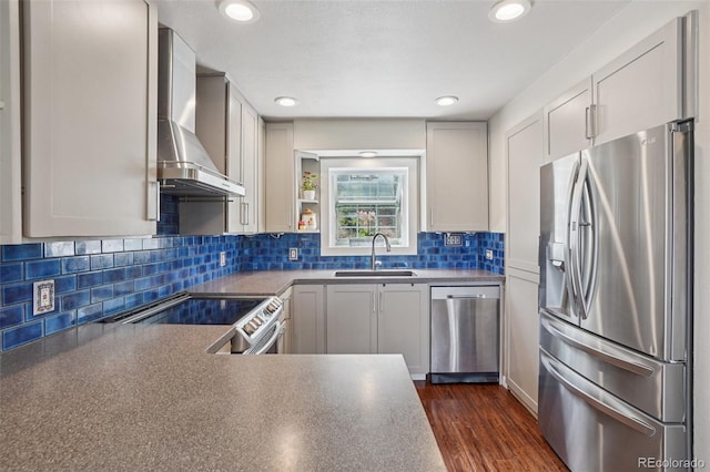 150 Cedar Rd, Evergreen, CO 80439 - kitchen with appliances with stainless steel finishes, wall chimney exhaust hood, dark countertops, dark wood-style floors, and backsplash