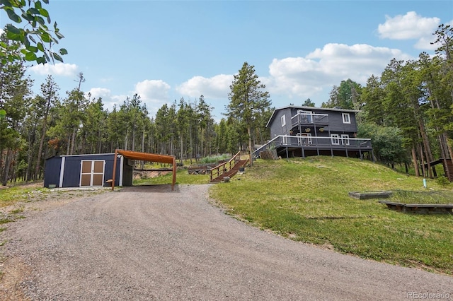 150 Cedar Rd, Evergreen, CO 80439 - view of dirt / gravel road featuring a wooded view and stairs