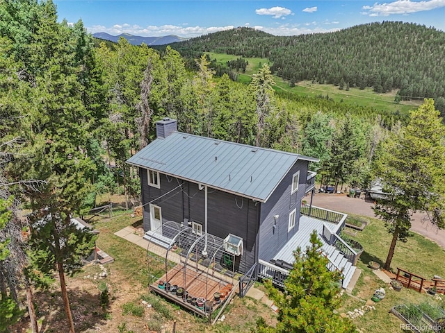 150 Cedar Rd, Evergreen, CO 80439 - view of subject property featuring a heavily wooded area and mountains