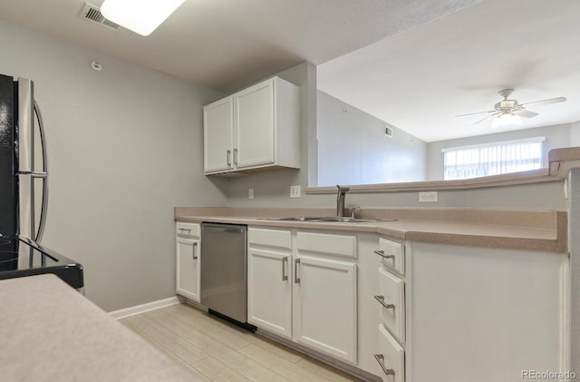 7440 S Blackhawk St Unit 12-204, Englewood, CO 80112 - kitchen with appliances with stainless steel finishes, a sink, a peninsula, ceiling fan, and light countertops