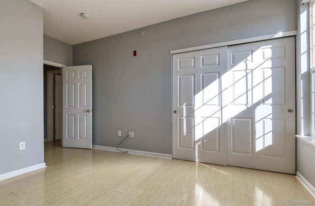 7440 S Blackhawk St Unit 12-204, Englewood, CO 80112 - entrance foyer featuring baseboards and light wood-style floors