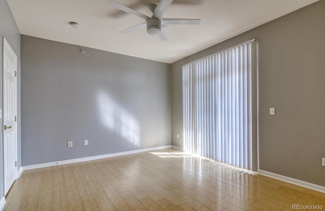 7440 S Blackhawk St Unit 12-204, Englewood, CO 80112 - empty room with a ceiling fan, wood finished floors, baseboards, and a smoke detector