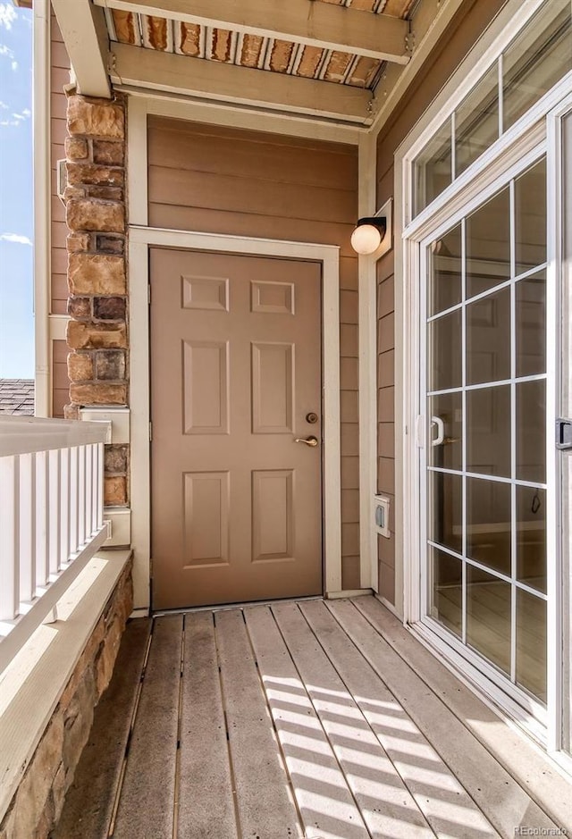 7440 S Blackhawk St Unit 12-204, Englewood, CO 80112 - property entrance with stone siding and a balcony