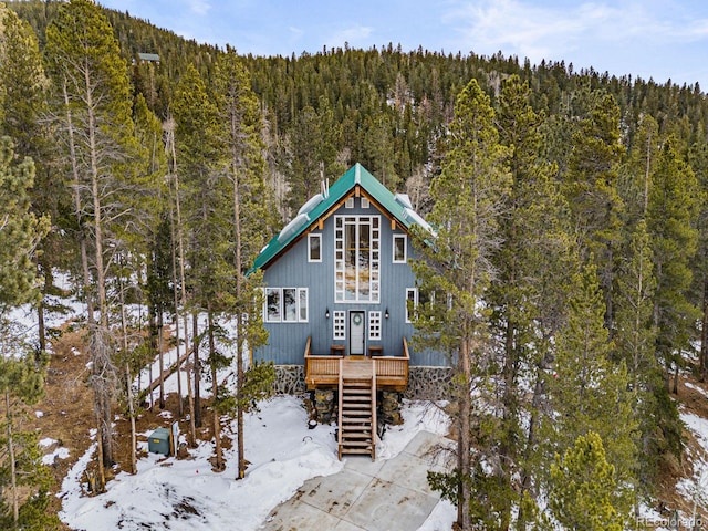 view of snow covered house