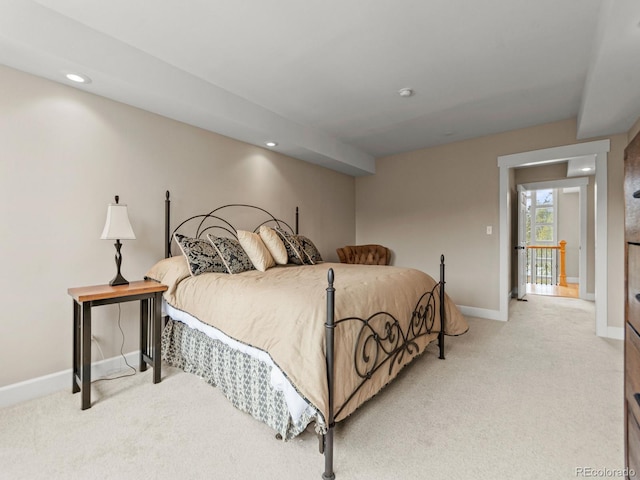 bedroom with light colored carpet