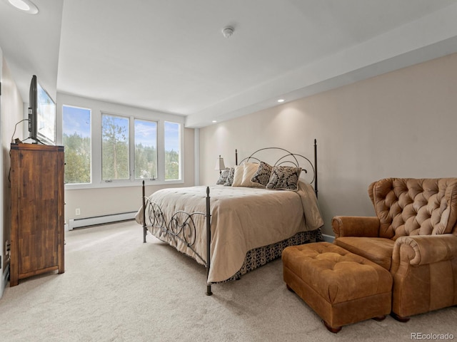 carpeted bedroom featuring a baseboard radiator