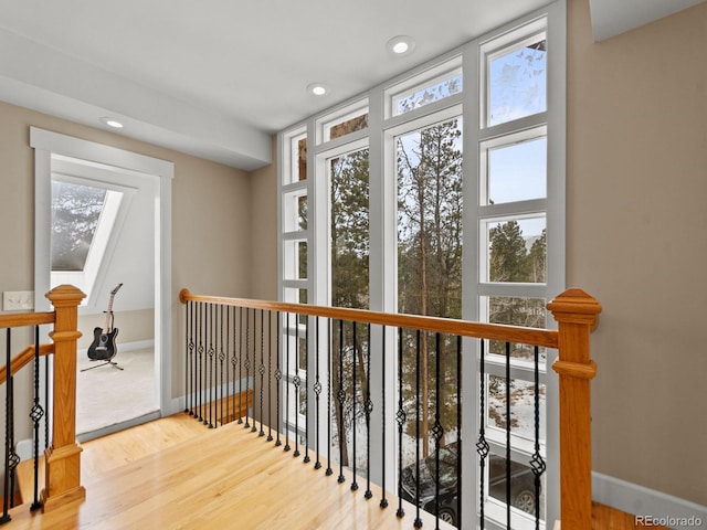 hallway with light hardwood / wood-style flooring