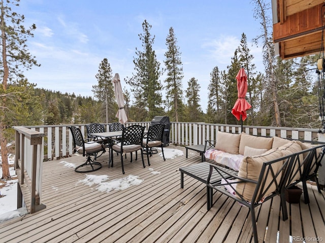 wooden deck featuring an outdoor living space