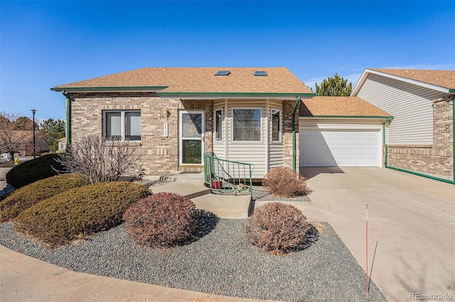 view of front facade featuring a garage, driveway, brick siding, and roof with shingles