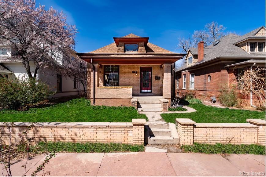615 S Grant St, Denver, CO 80209 - bungalow-style home with brick siding and covered porch