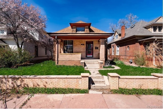 615 S Grant St, Denver, CO 80209 - bungalow-style home with brick siding and covered porch