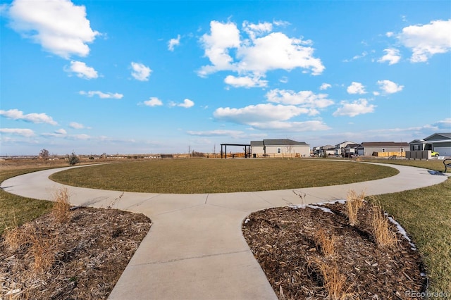 view of property's community featuring a lawn