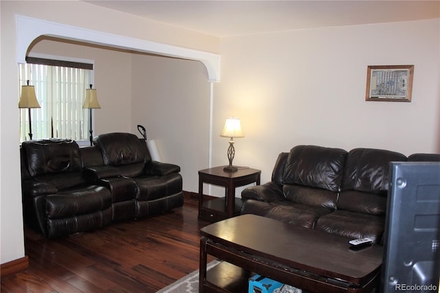 living area featuring wood finished floors and baseboards