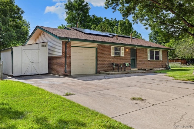 5193 Zinnia St, Arvada, CO 80002 - single story home with brick siding, solar panels, a front lawn, a garage, and driveway