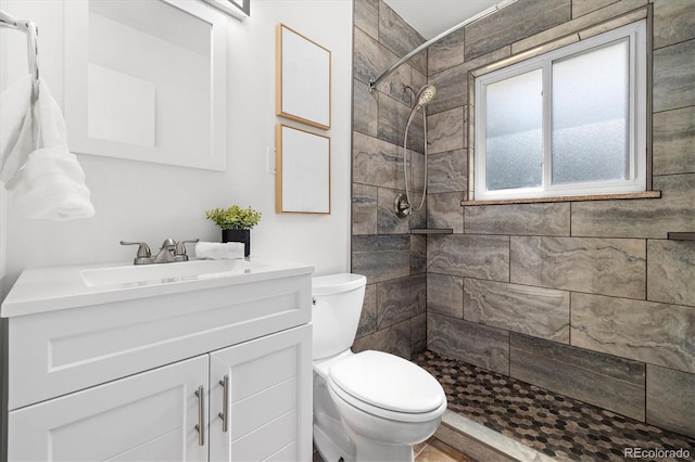 5193 Zinnia St, Arvada, CO 80002 - bathroom with vanity and tiled shower