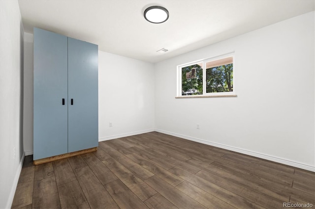 5193 Zinnia St, Arvada, CO 80002 - unfurnished bedroom featuring dark wood-style flooring and baseboards