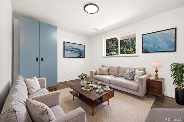 5193 Zinnia St, Arvada, CO 80002 - living area featuring baseboards and wood finished floors