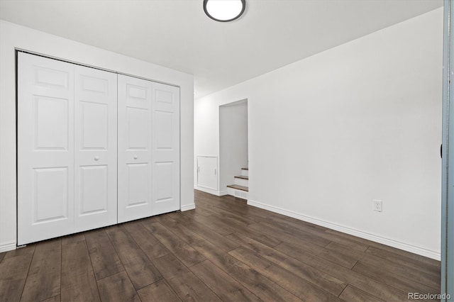 5193 Zinnia St, Arvada, CO 80002 - unfurnished bedroom featuring dark wood-style flooring and a closet